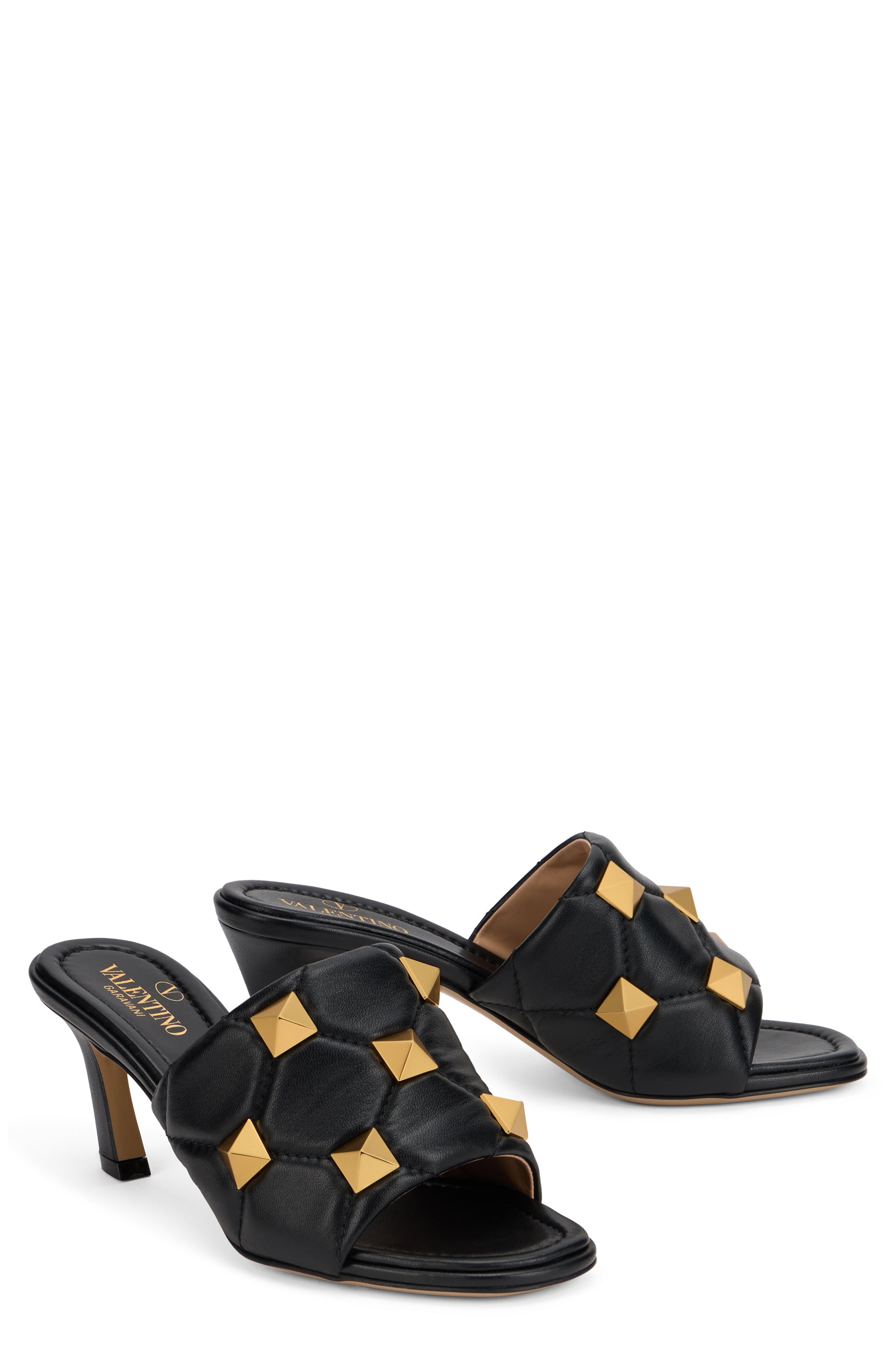 Elegant sandal with heel and decorative studs