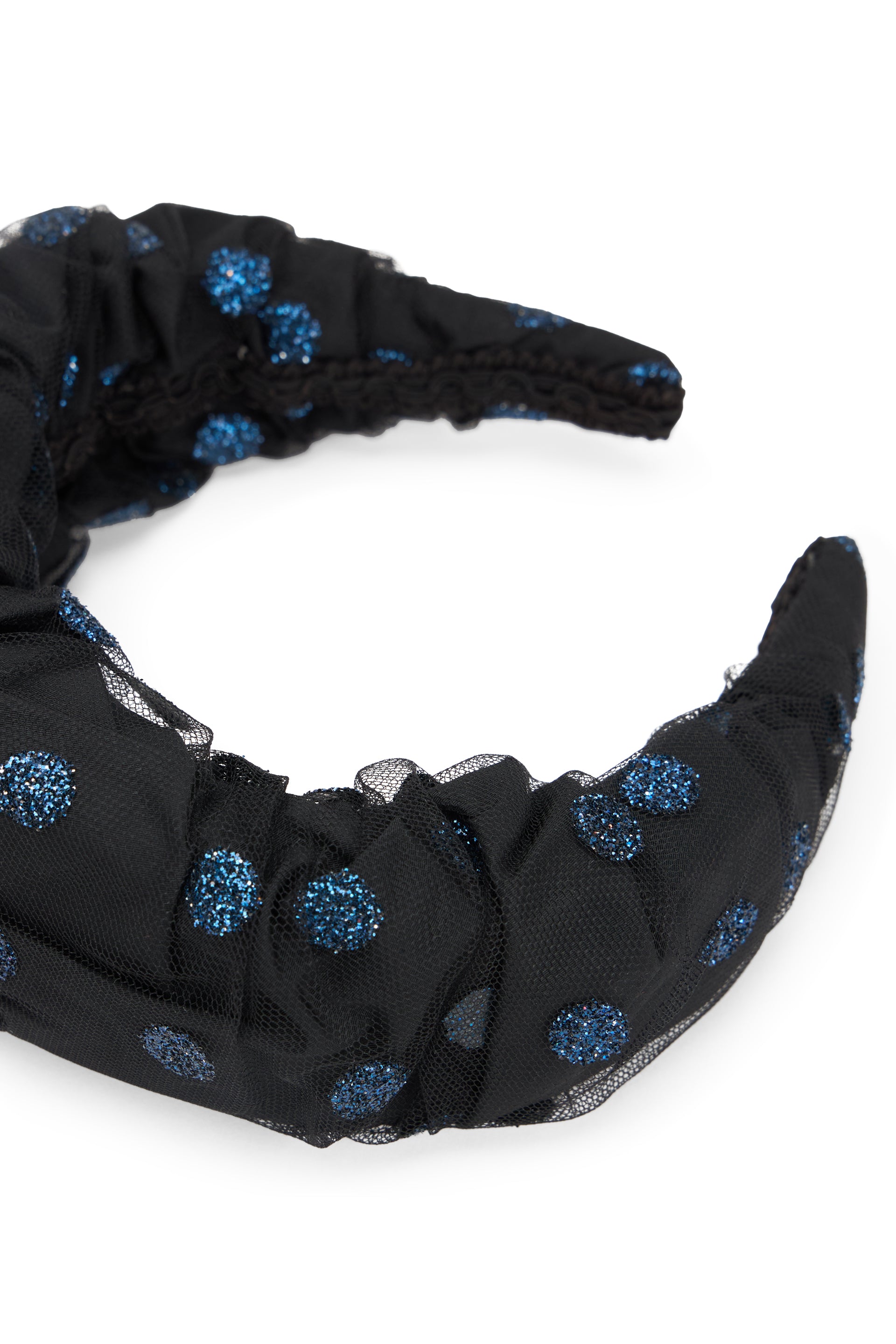 Black hairband with polka dot pattern in shades of blue, elegant and versatile.