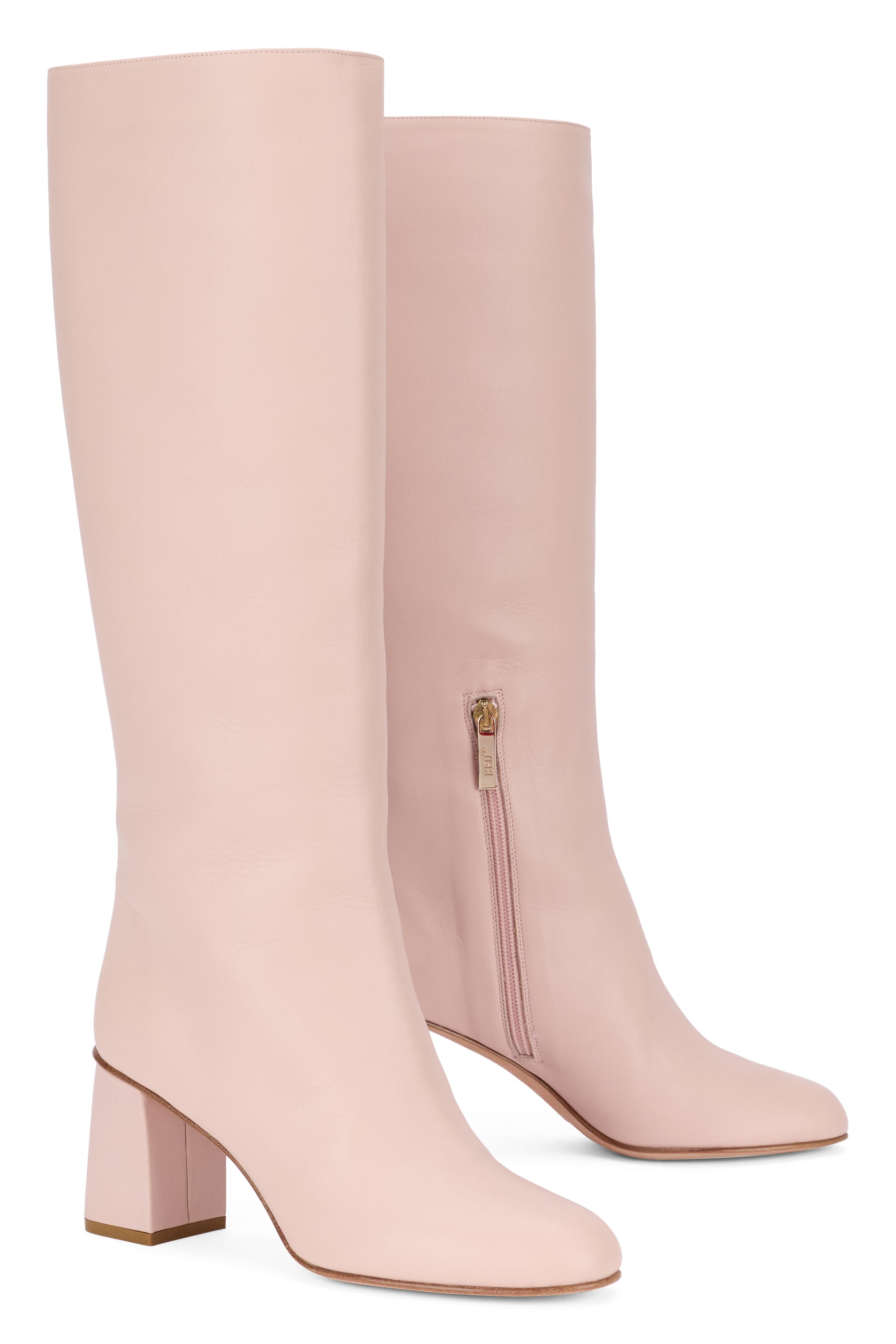 Tall pale pink boot, elegant, comfortable and versatile.