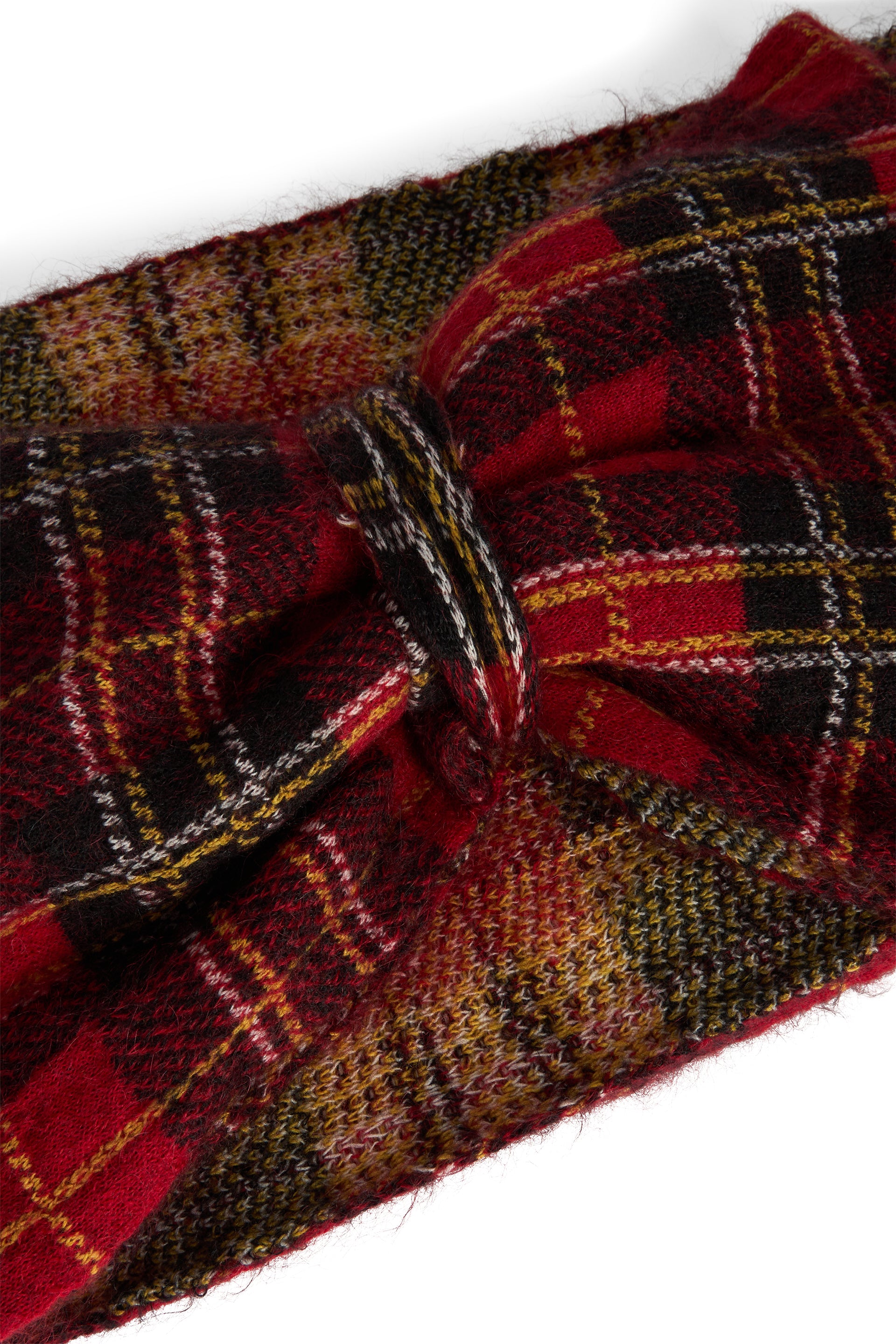 Elegant hairband with red and black tartan pattern.