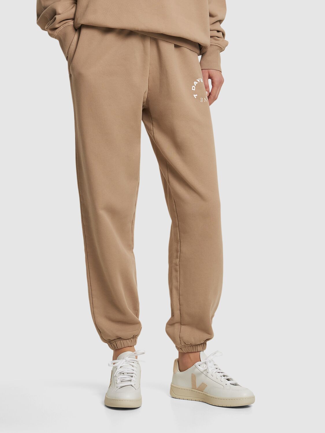 White minimalist sneakers with elegant beige details