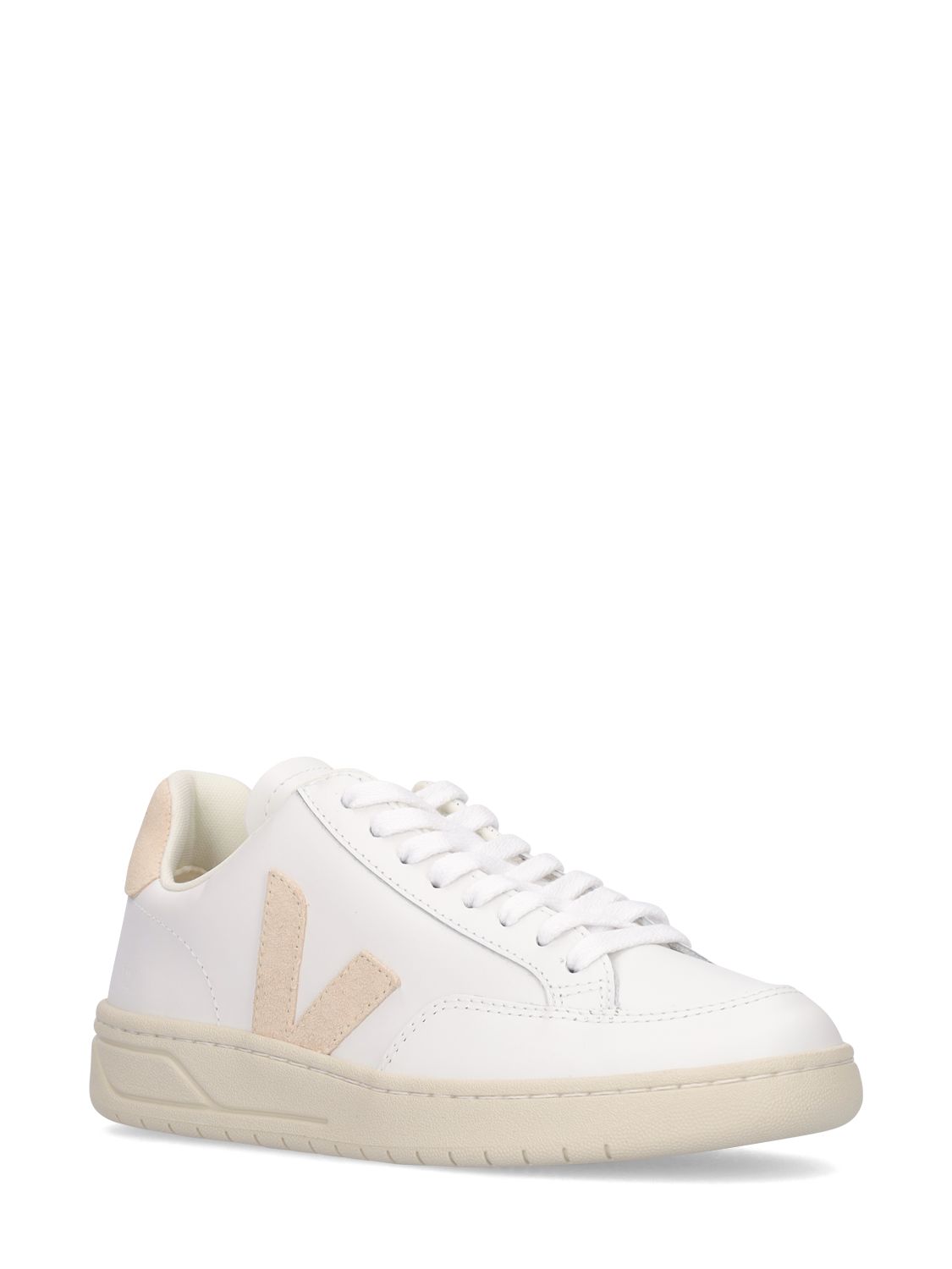 White minimalist sneakers with elegant beige details