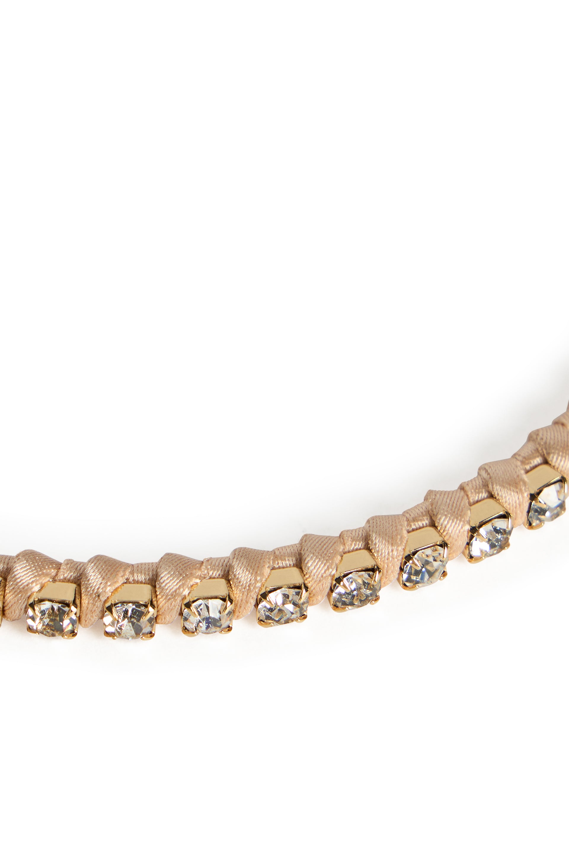 Beige bracelet with adjustable closure and gemstones.