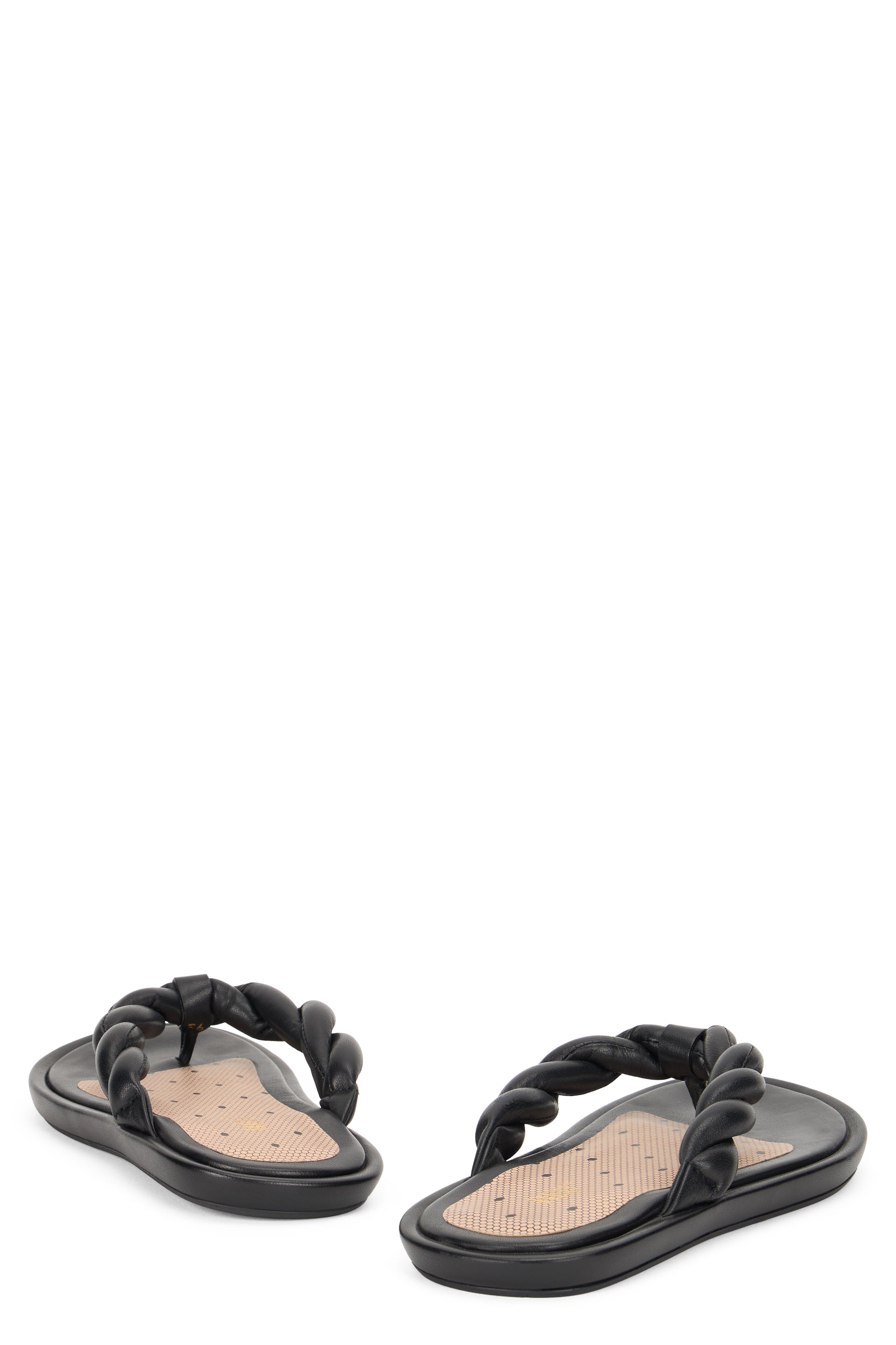 Elegant low sandals in black with braided straps.