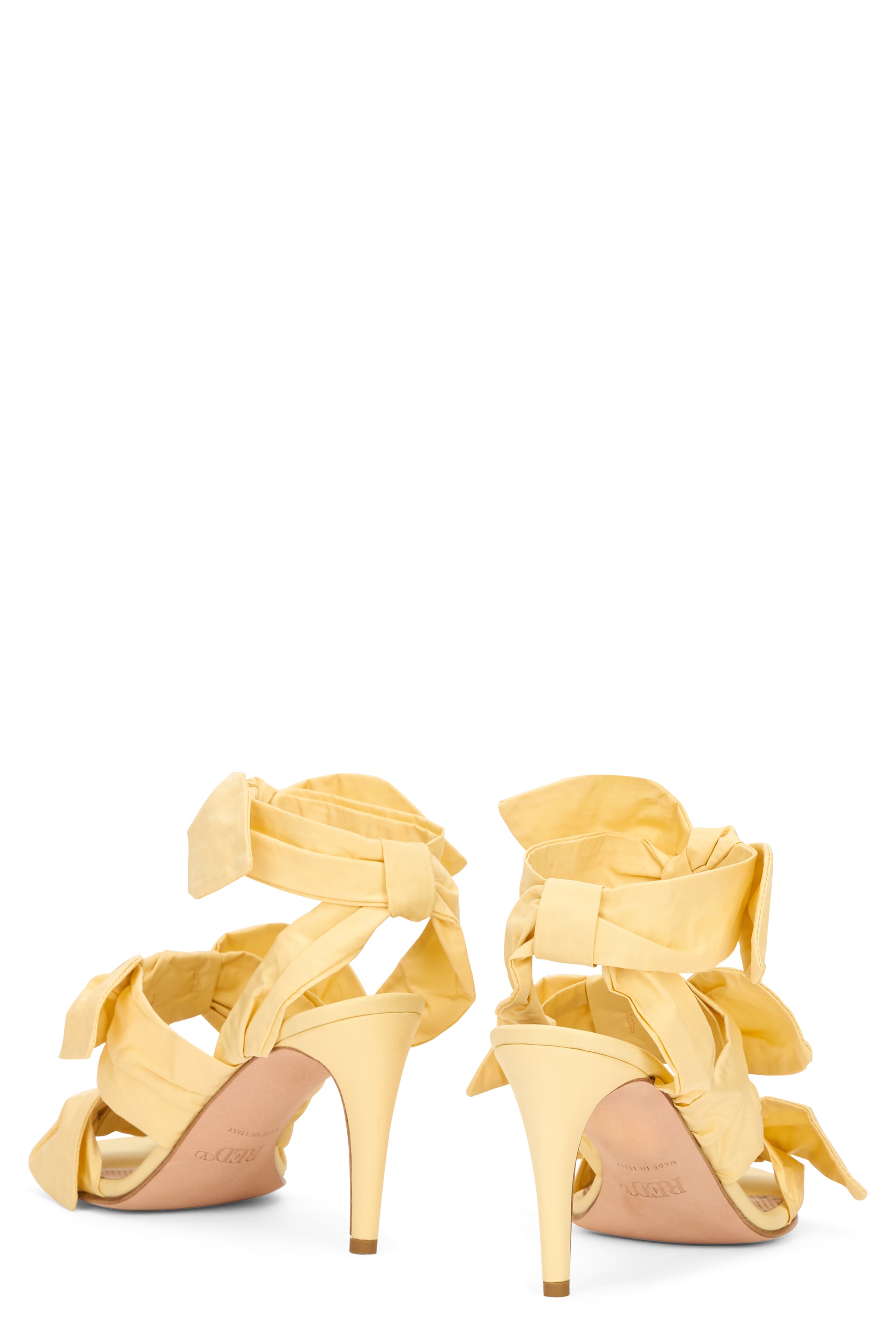 Elegant yellow sandal with high heel.