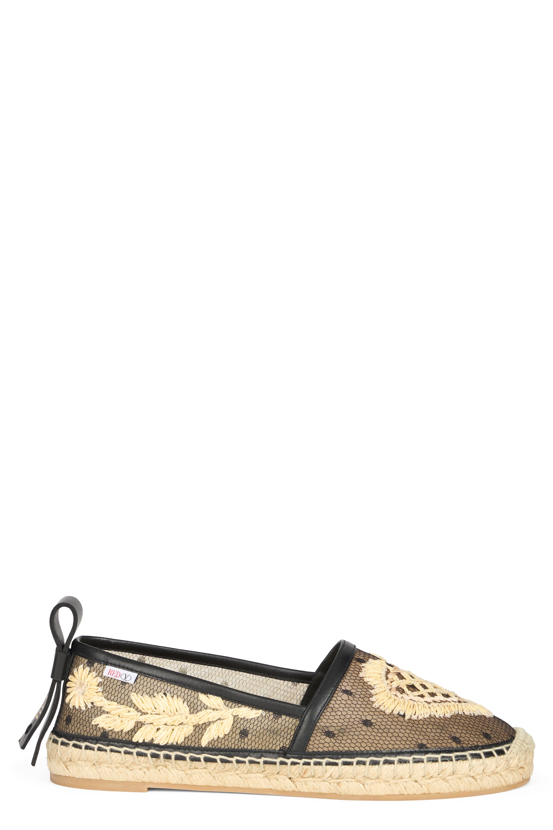 Black espadrilles transparent with floral details.