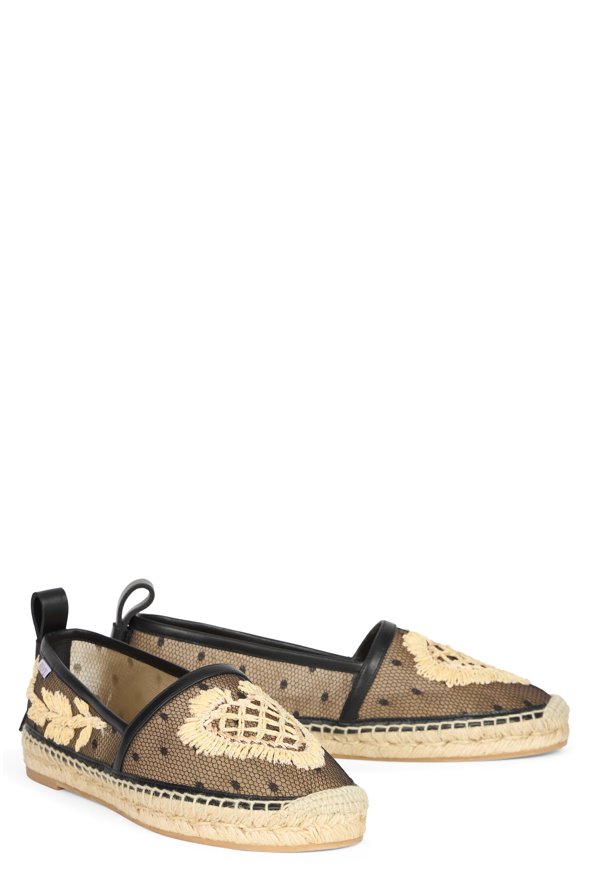 Black espadrilles transparent with floral details.