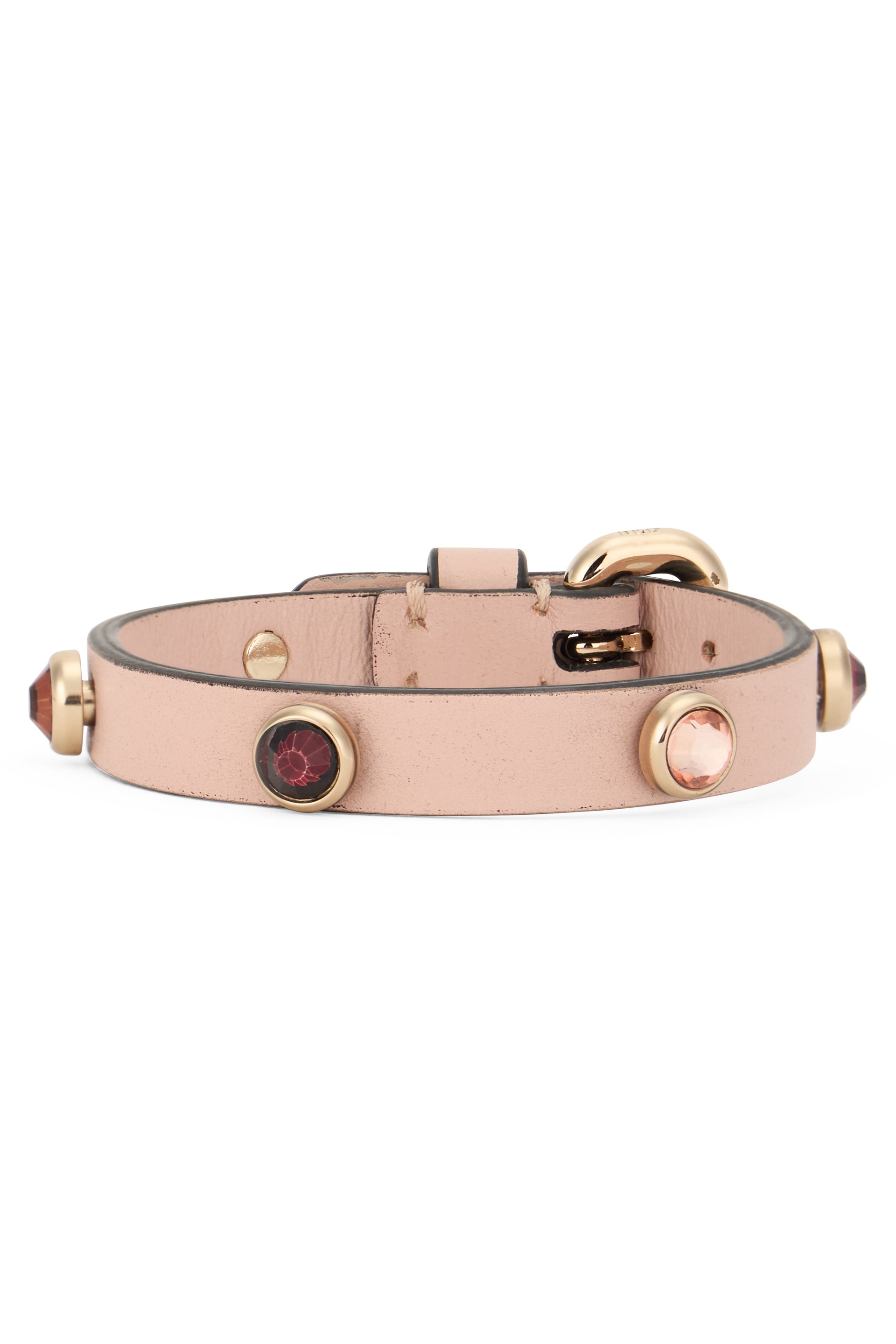 Elegant golden pink bracelet with decorative gems.