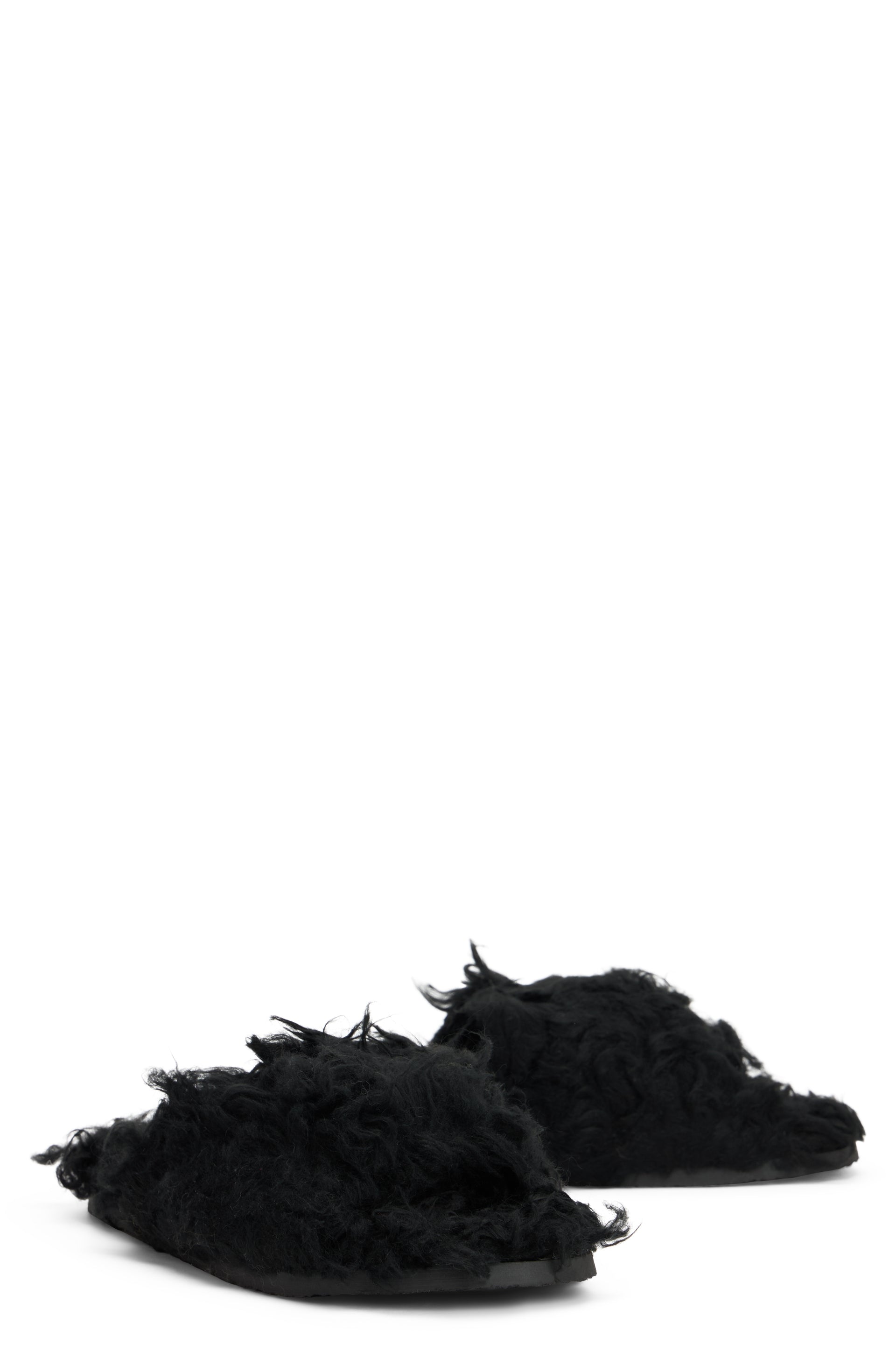 Black fur sandals with modern and comfortable design.