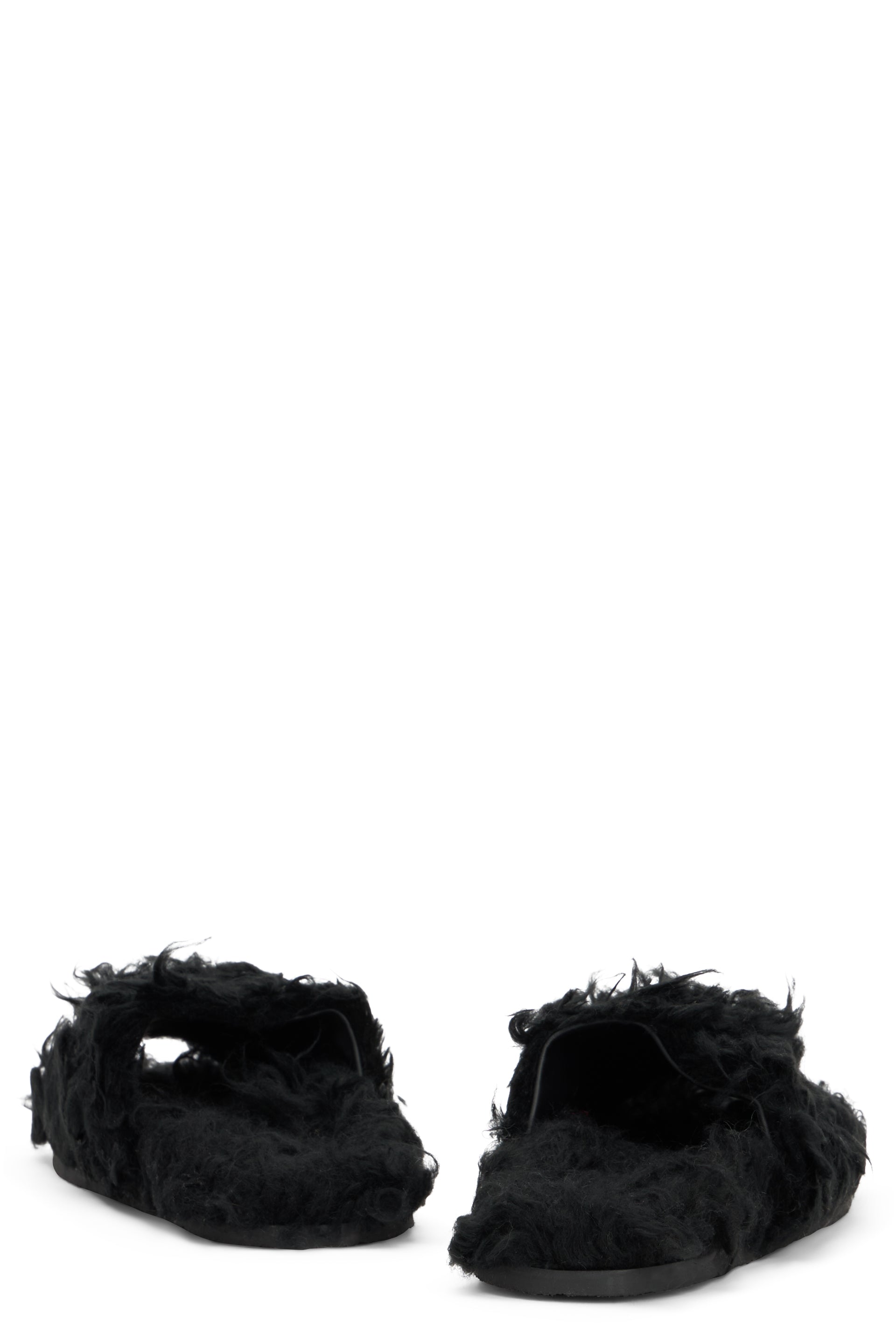 Black fur sandals with modern and comfortable design.