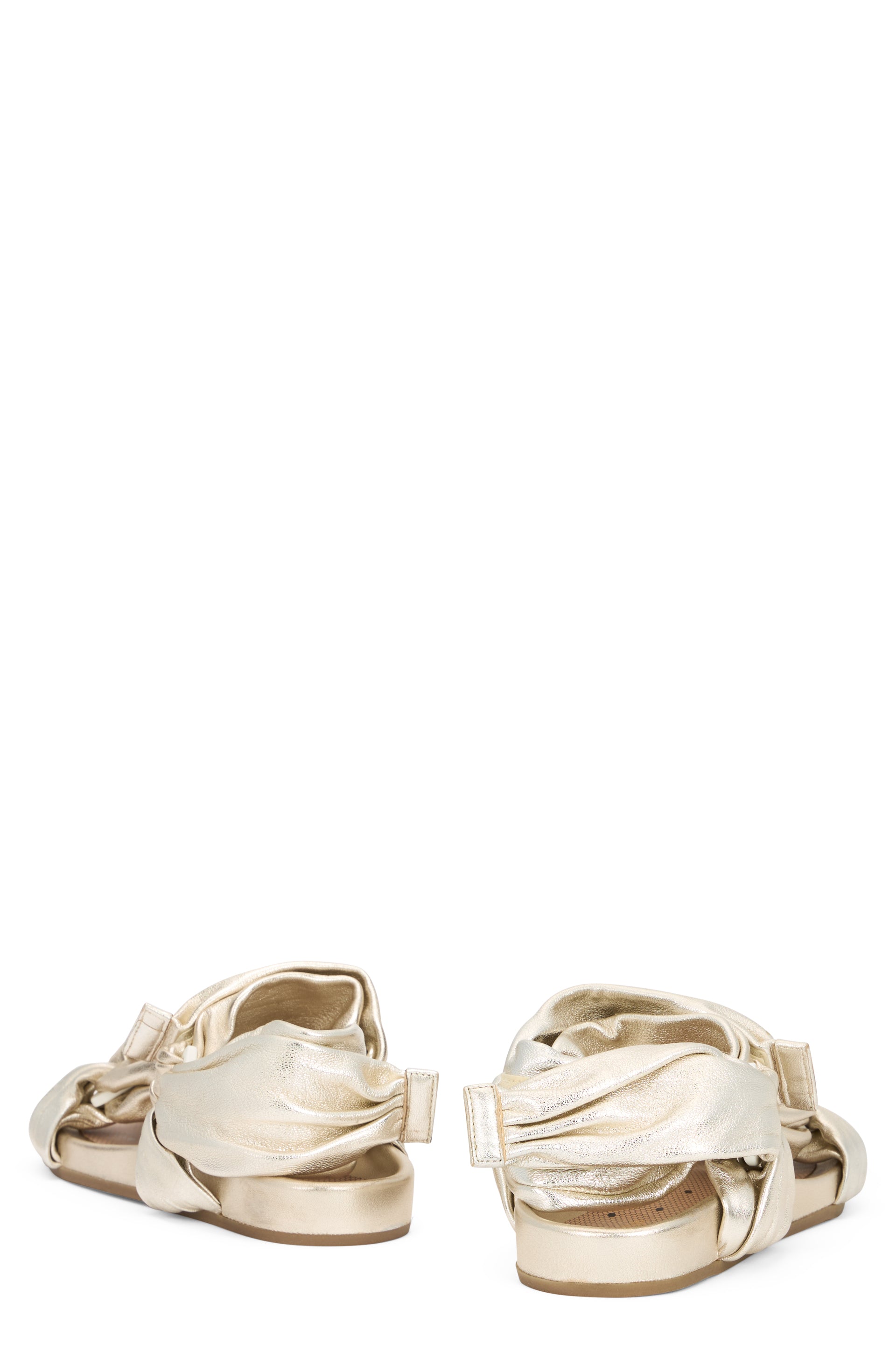 Light sandals in gold color with a low sole and modern, versatile design.