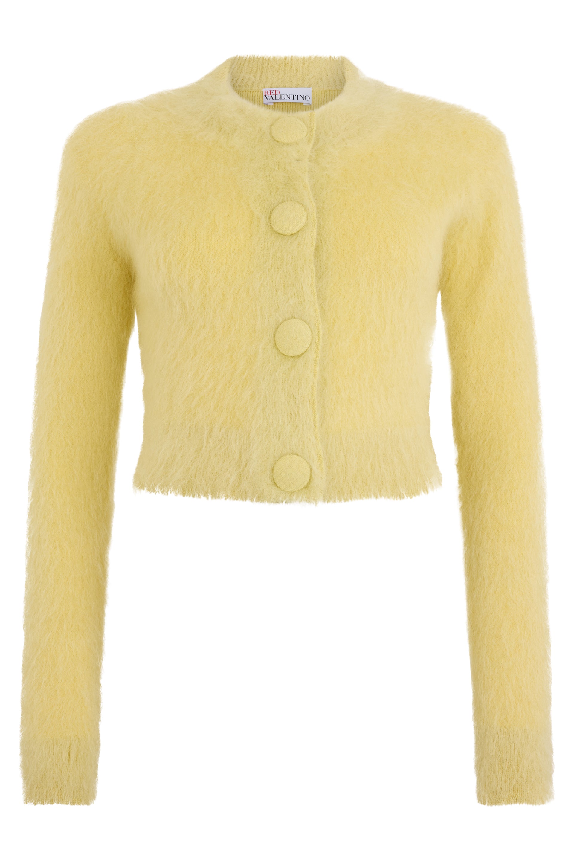 Yellow cropped jacket with elegant buttons.