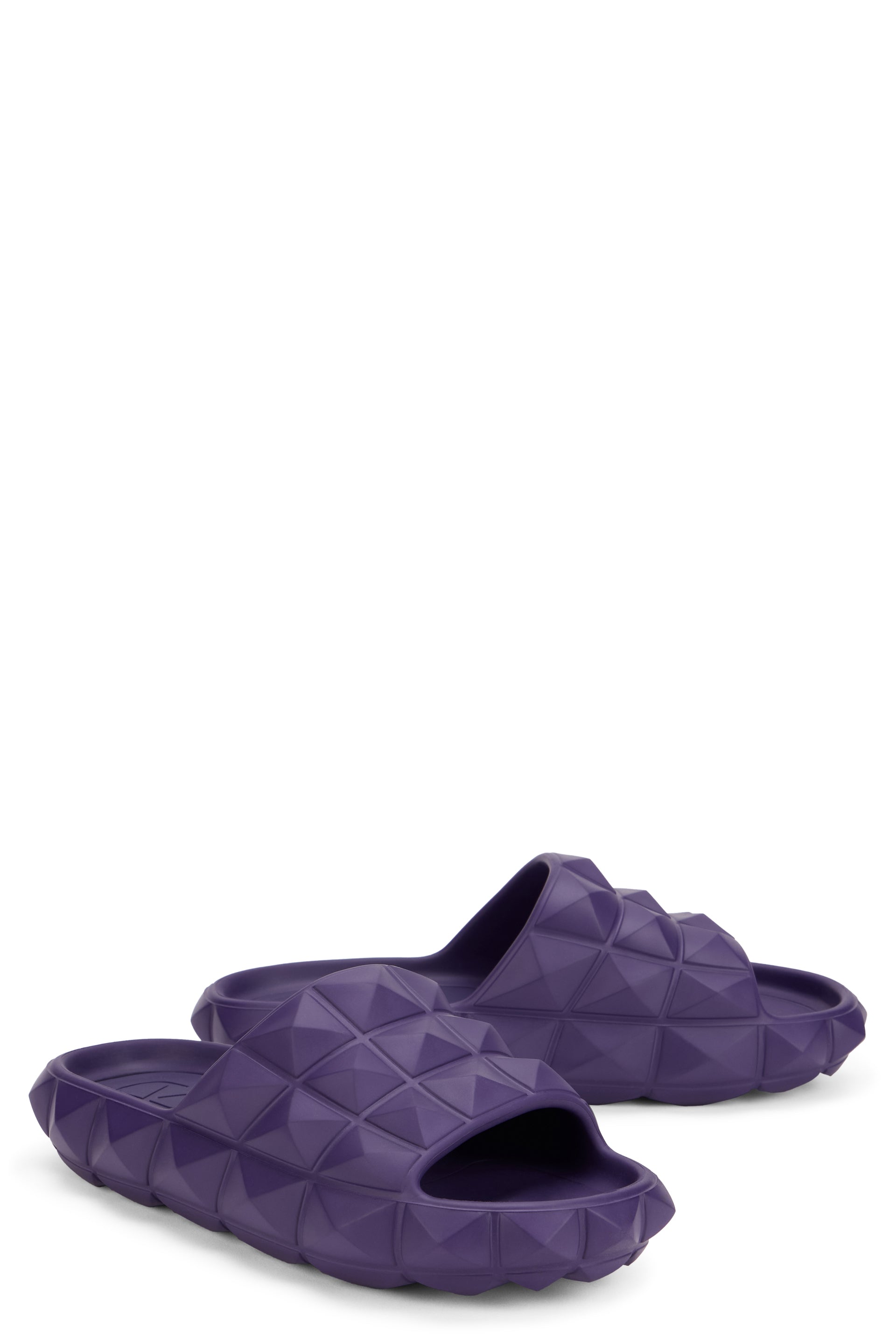 Purple slippers with a casual yet refined design.