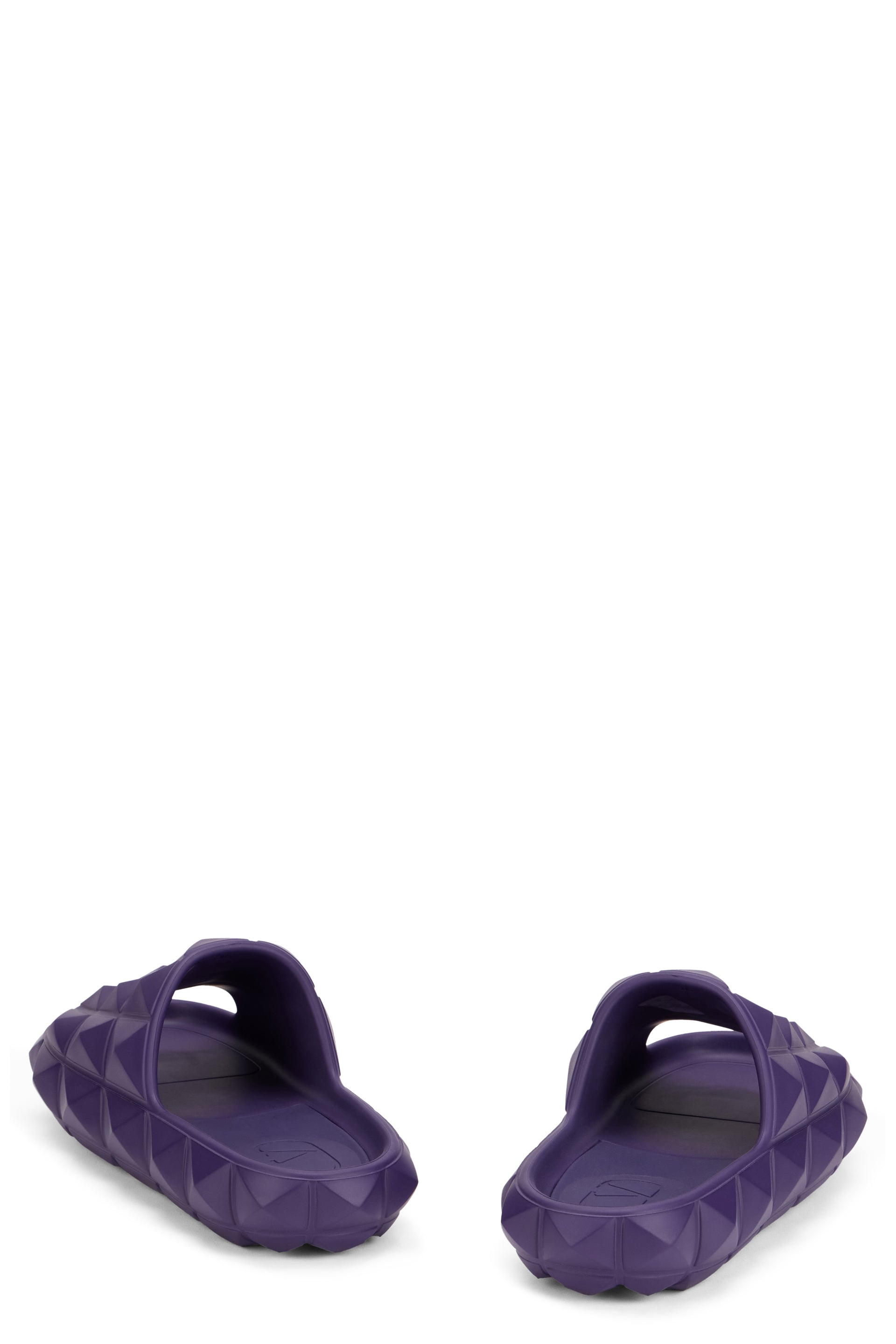 Purple slippers with a casual yet refined design.