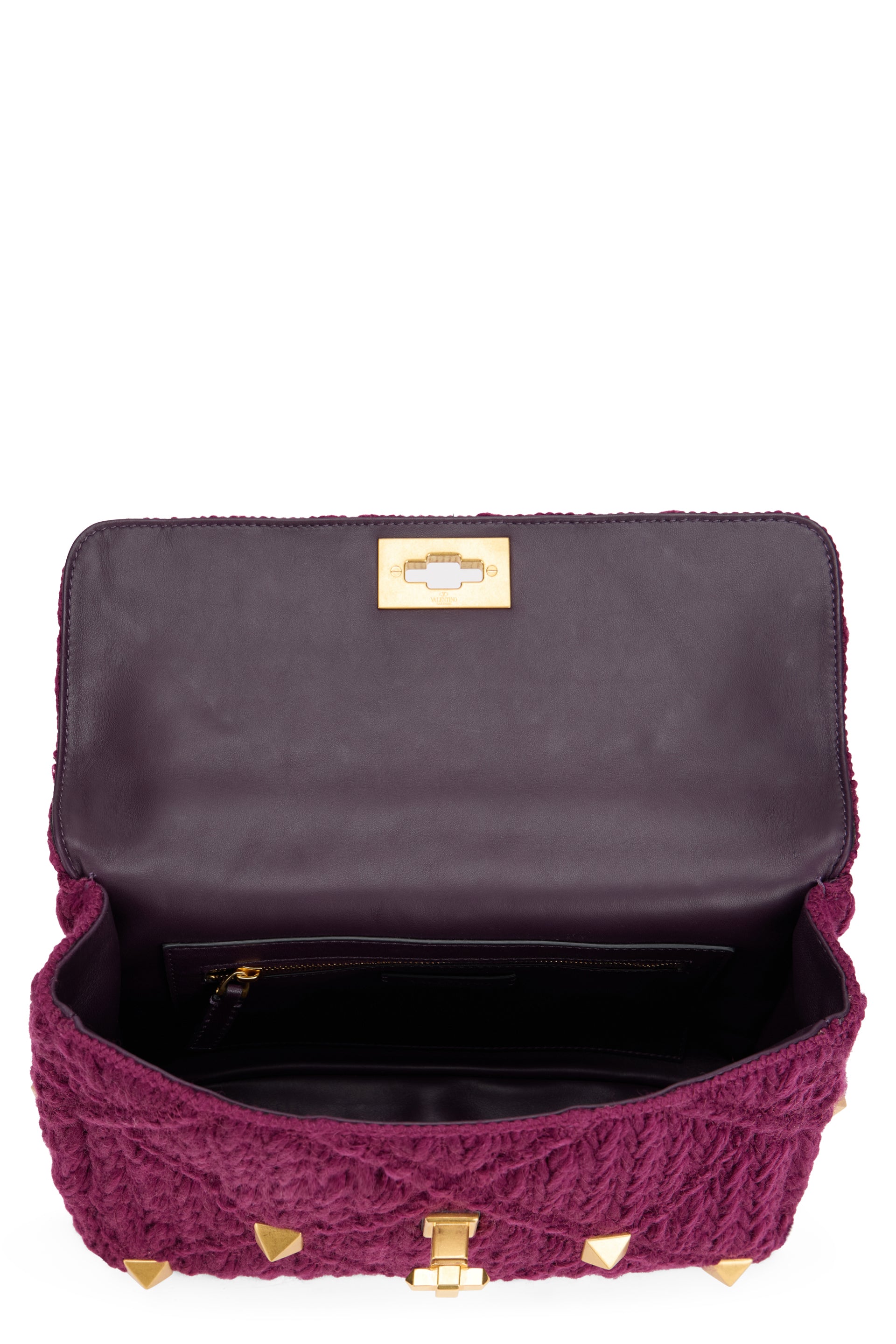 Elegant purple bag with golden details