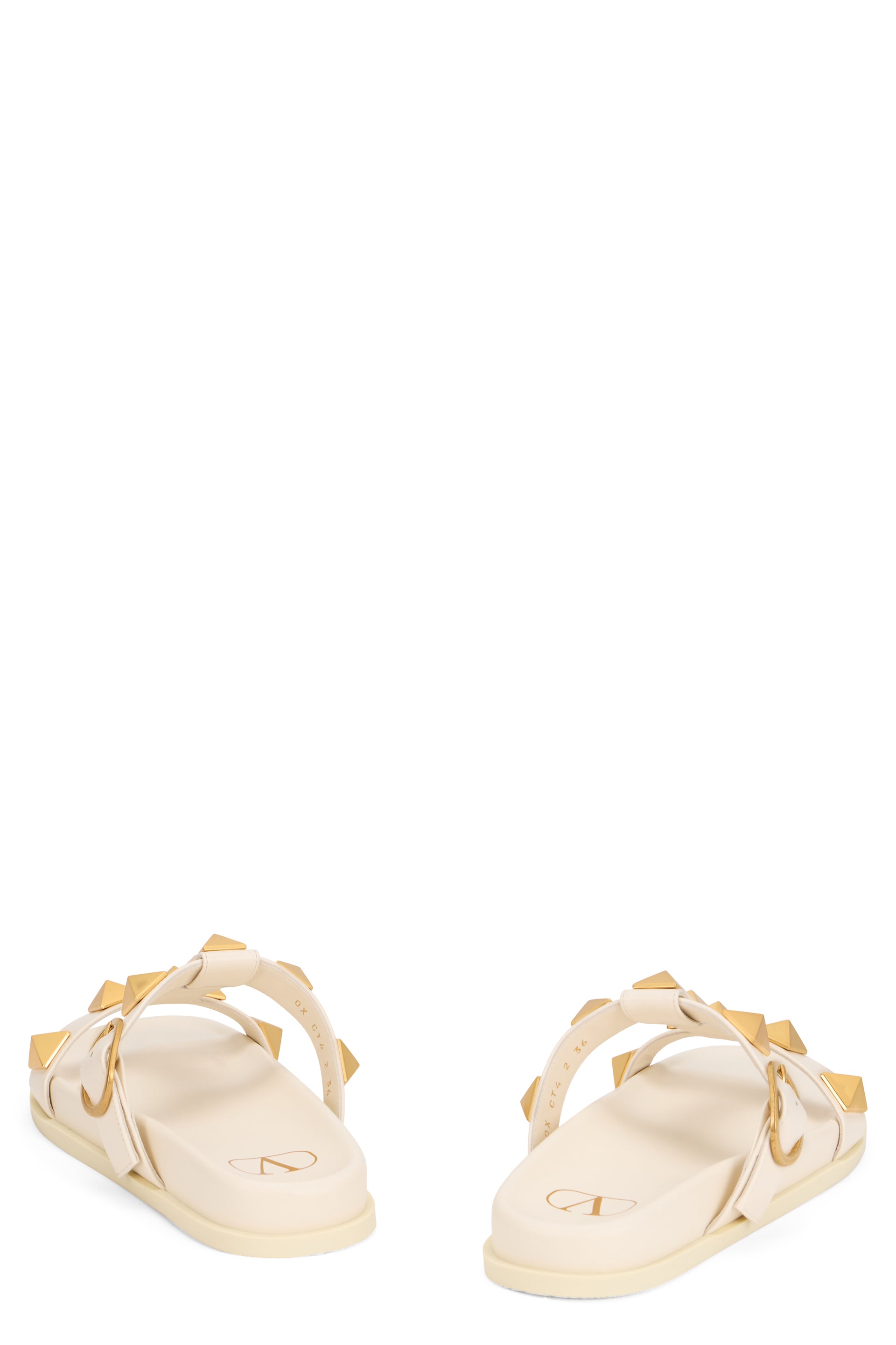 Elegant minimal platform sandals with gold studs.